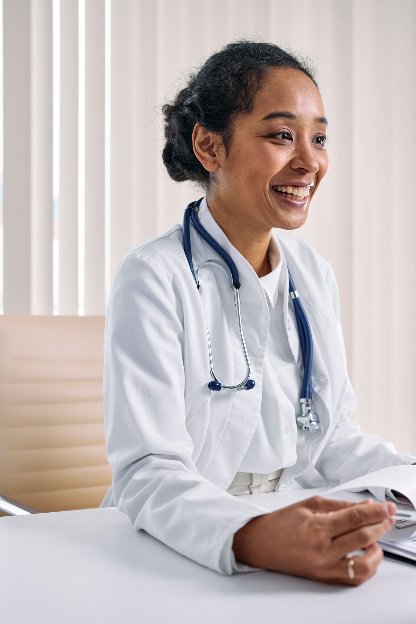 A health professional smiling during a conversation